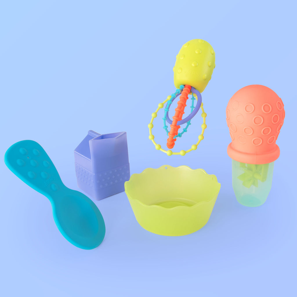 5 baby bath toys: blue spoon, green bowl, purple milk carton, multicolored whisk, and orange and green baster