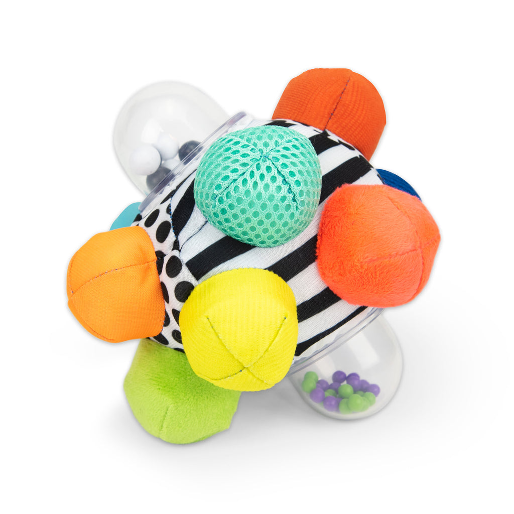 black and white plush ball with multicolored bumps coming off of the ball and two clear bumps with beads in them.