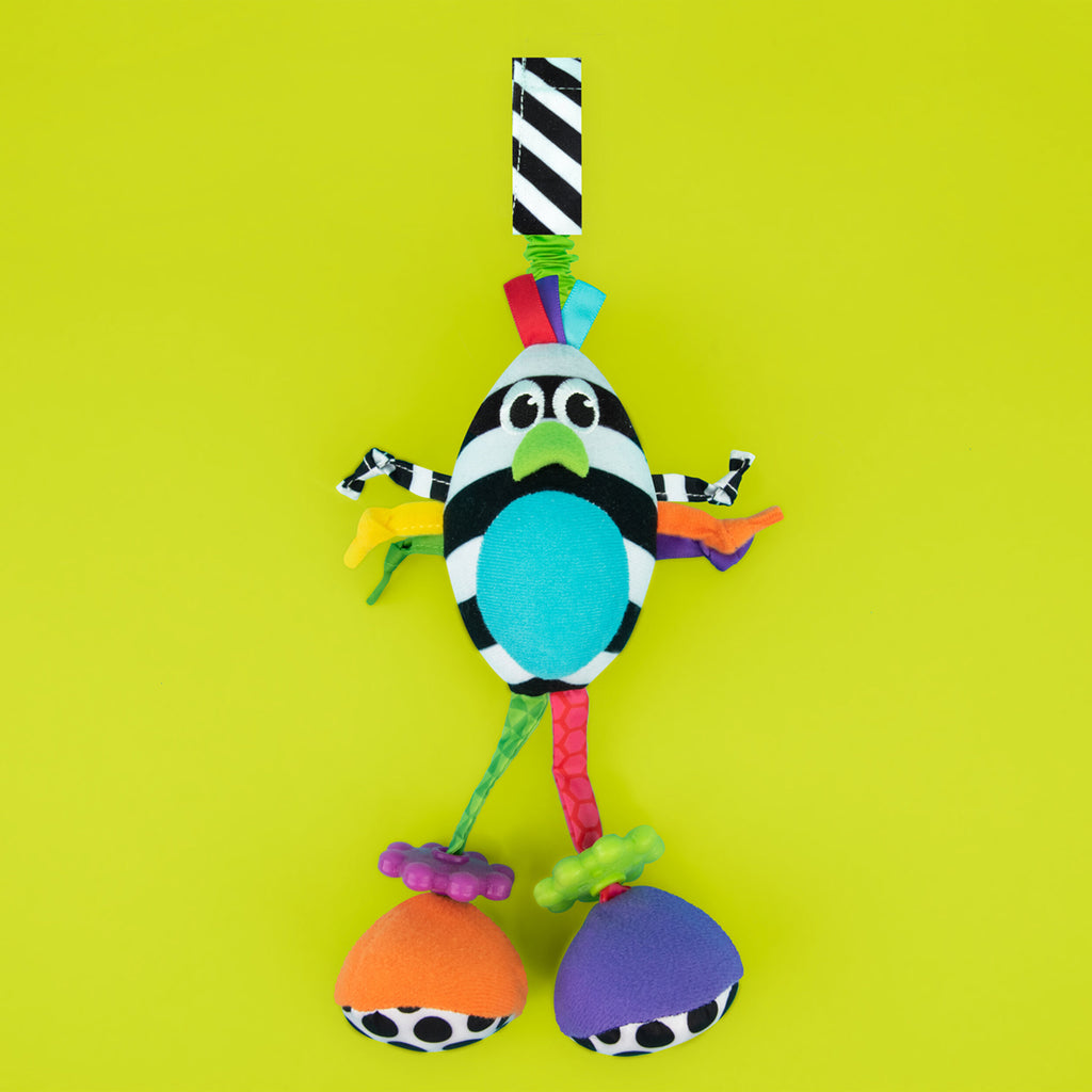 black and white bird hanging toy with colorful arms and legs