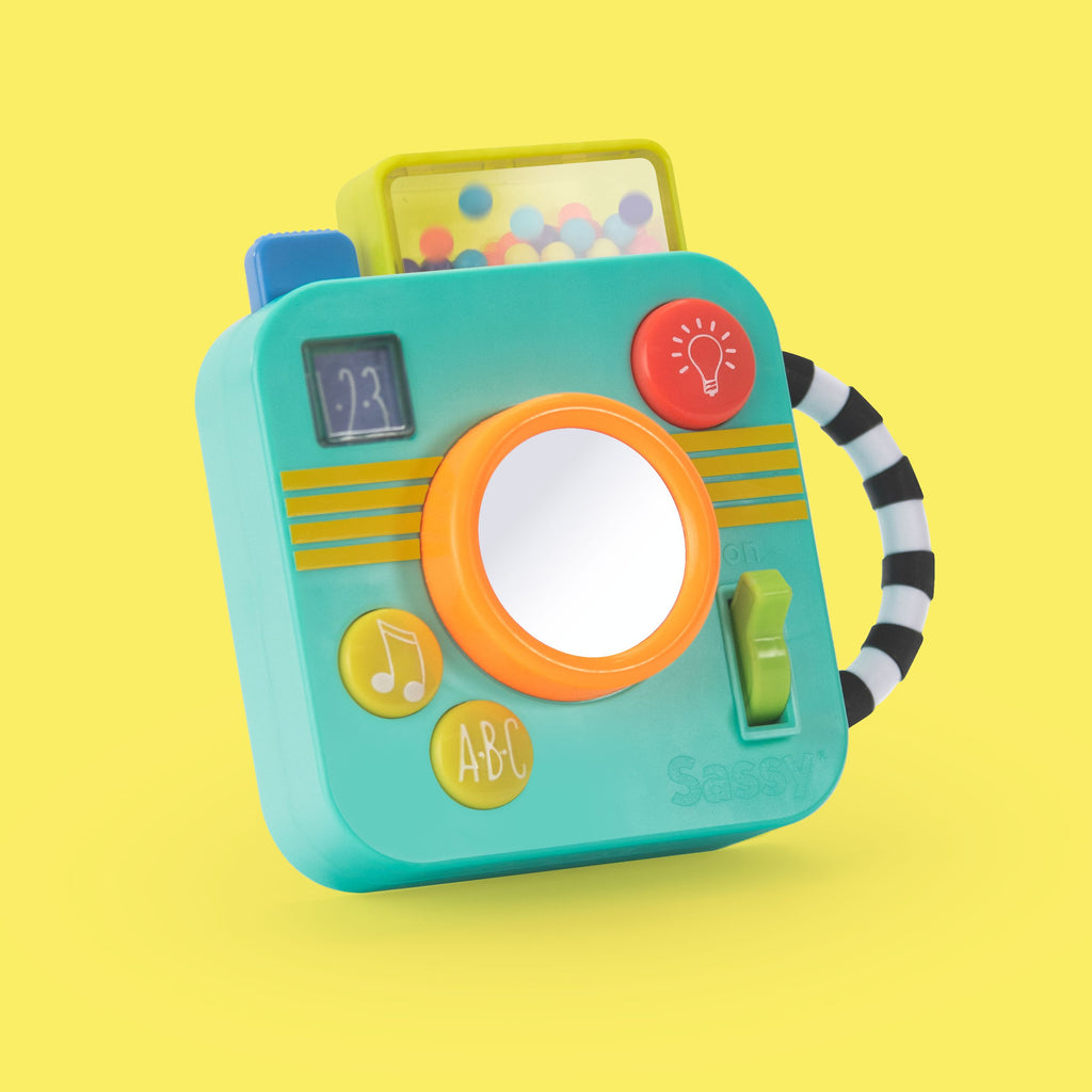 blue camera baby toy with different colored buttons and switches and black and white handle