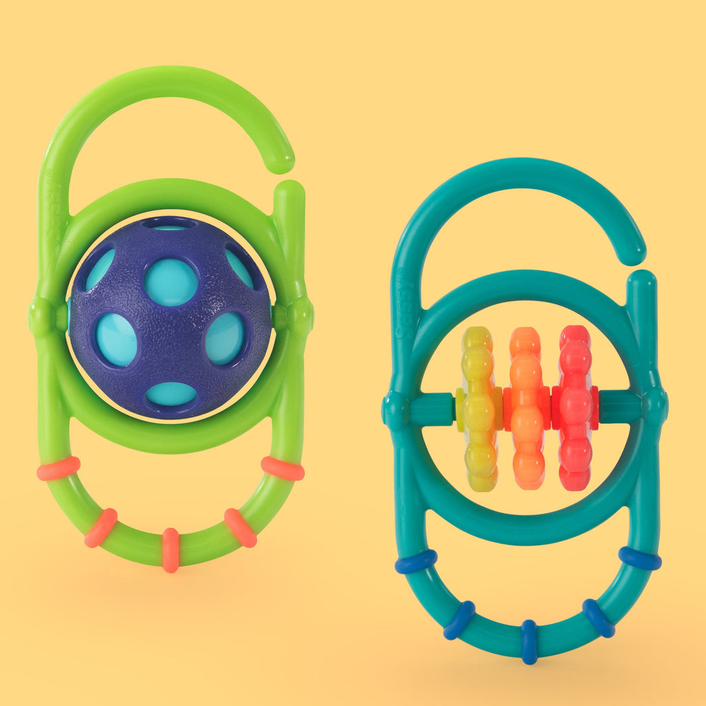 Oval shaped toys that can link together. One green with a purple and blue rattle ball in the middle. One blue with yellow, orange, and red spinners in the middle. 