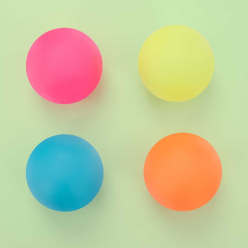 4 different colored balls pink, yellow, blue, orange. 