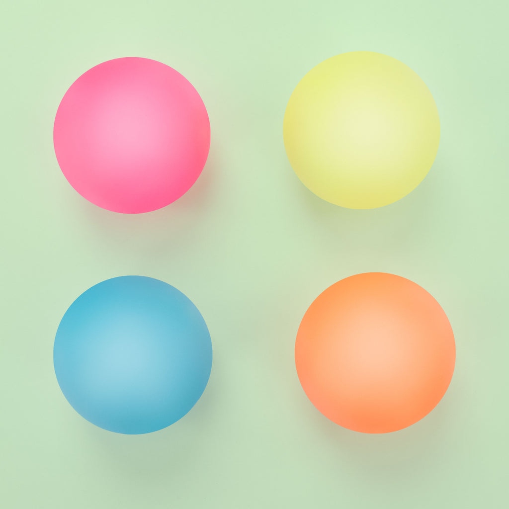 4 different colored balls pink, yellow, blue, orange lighting up.