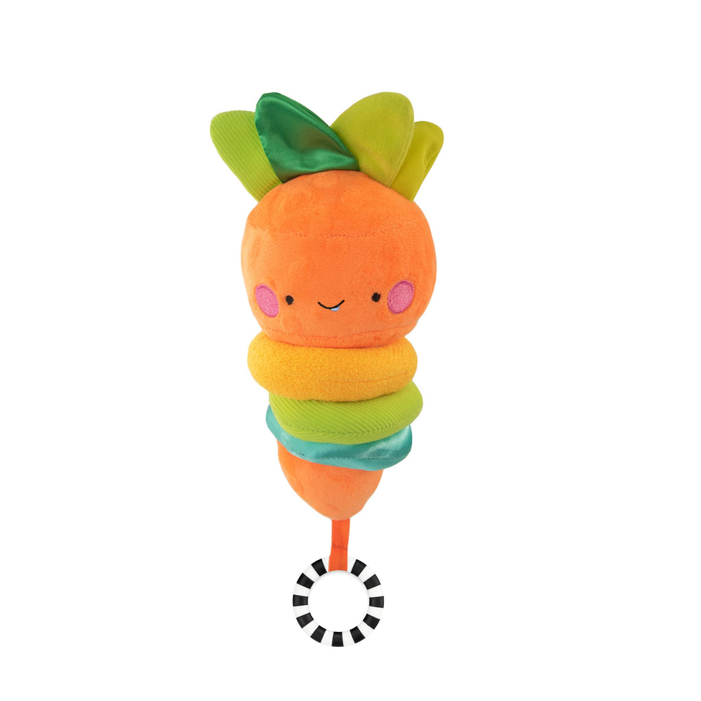 
a carrot-themed musical chime featuring a black and white striped ring at the bottom. when pulled down, the toy separates and gradually comes back together while playing a soft melody. the top of the carrot has four green leaves with various fabric textures, including one that makes a crinkle sound. the orange carrot has a friendly face and three soft, multi-colored textured rings below it