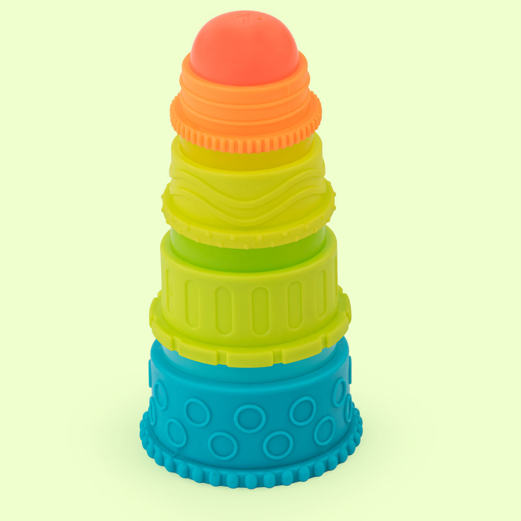 a four-piece set of multi-colored stacking cups, each featuring a variety of textures. the main structure of each cup is plastic, while the cup part has a smooth finish. the cups are designed to stack, with the smallest cup on top