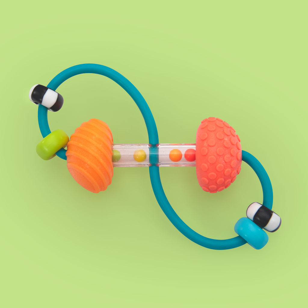 busy beads infinity rattle toy on a green background