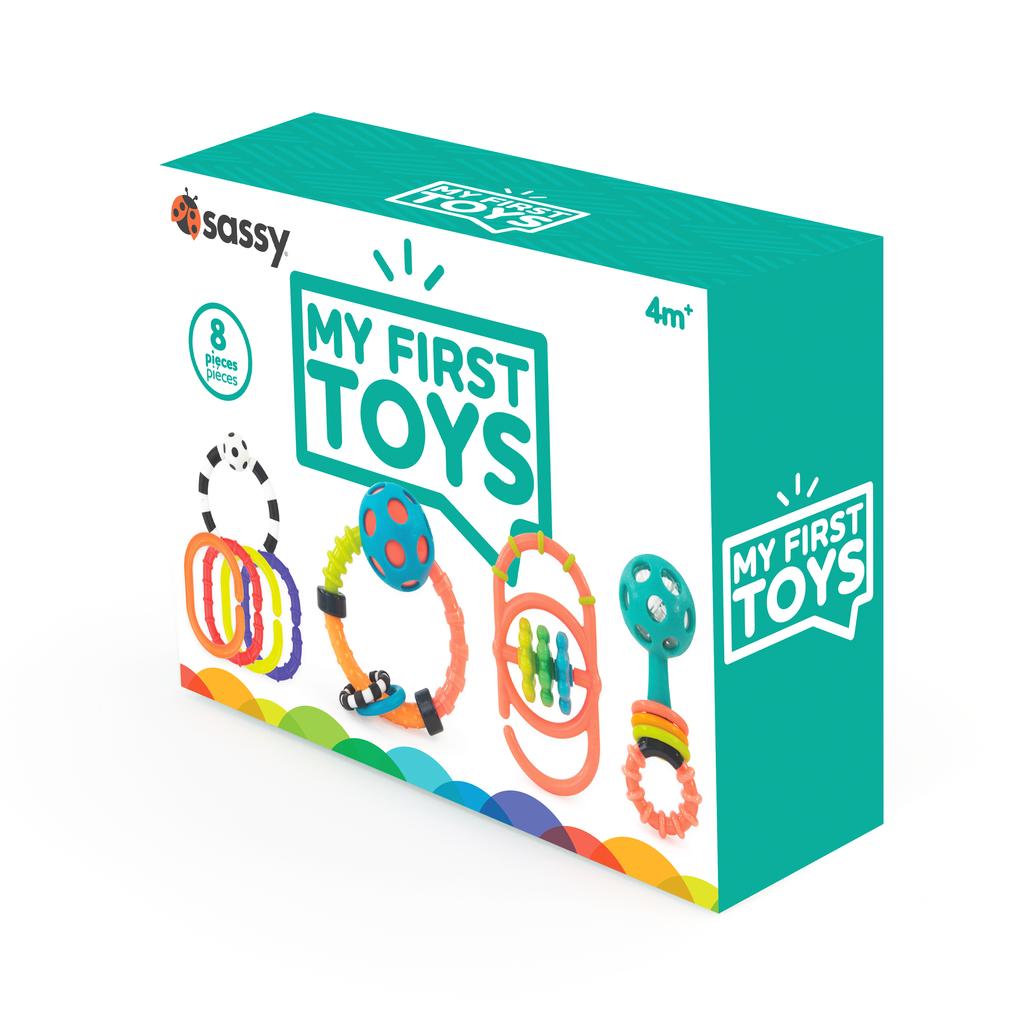 "my first toys" baby box Set of 4 baby links  with a black and white ring, ring rattle, link with spinning gears, and classic rattle with clear bead chamber.