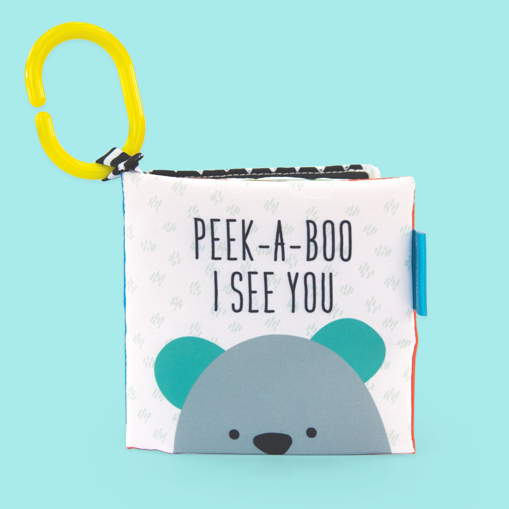 Peek-a-boo soft book with yellow link attached, and bears fac peeking up from the bottom.