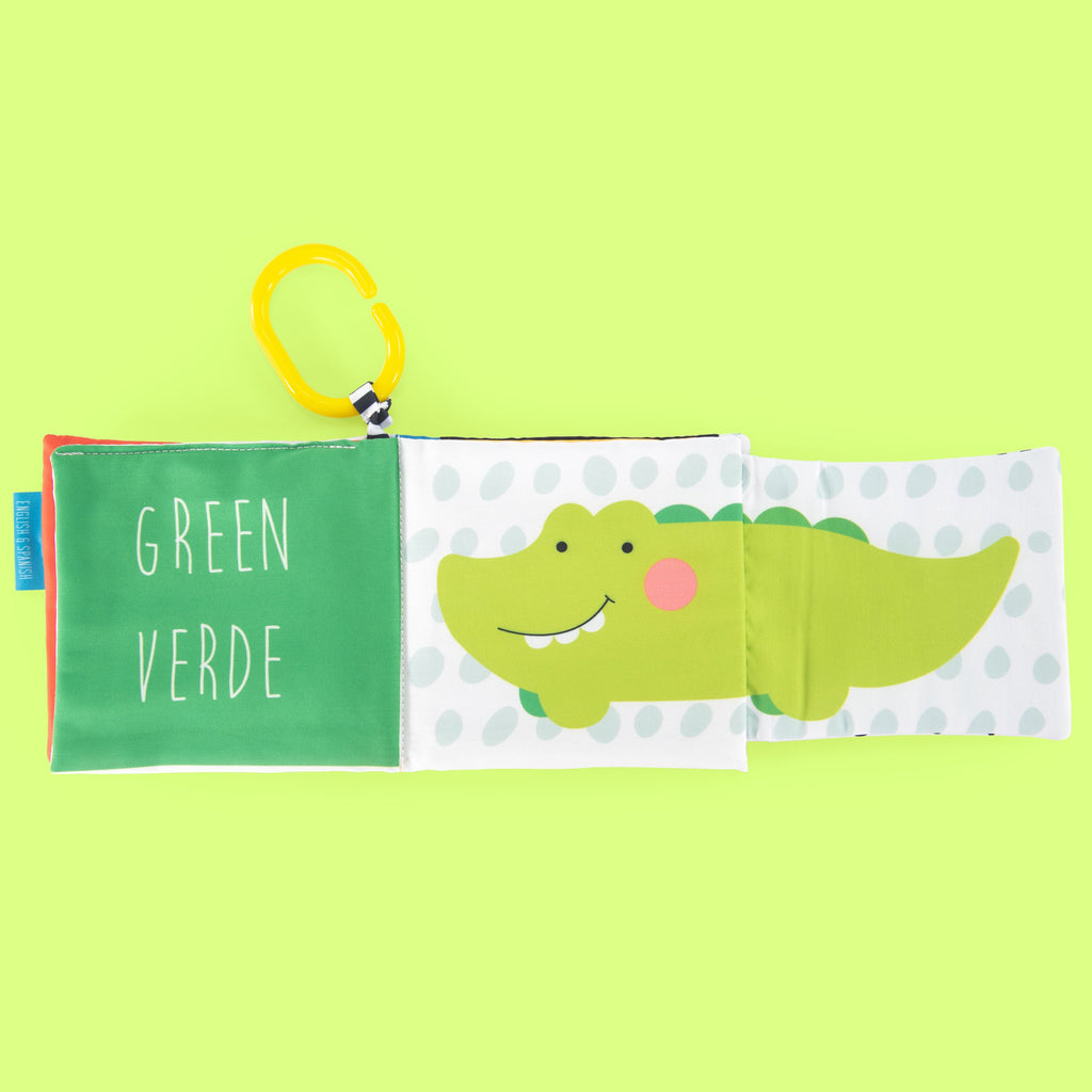 Green page with a crocodile that is revealed when page flips out and green in English and Spanish.