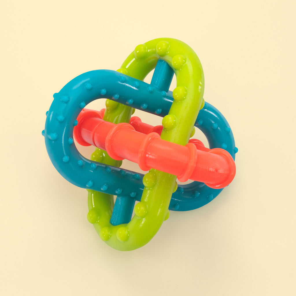 a teether with three different silicone colored and textured loops that all intertwine with one another.